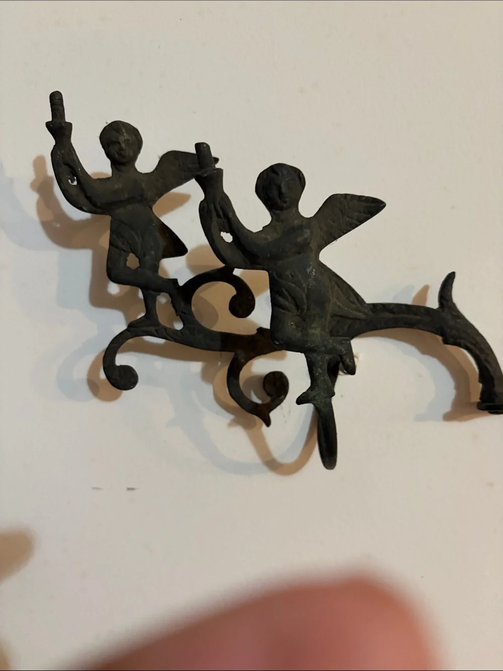 Cast iron coat rack with Cherubs. Mid century or earlier?